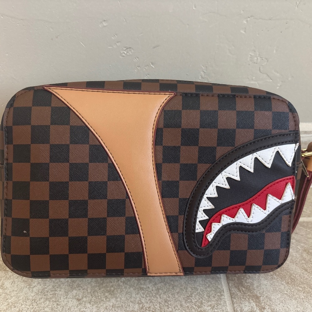 Limited edition spray ground bag with chic red interior